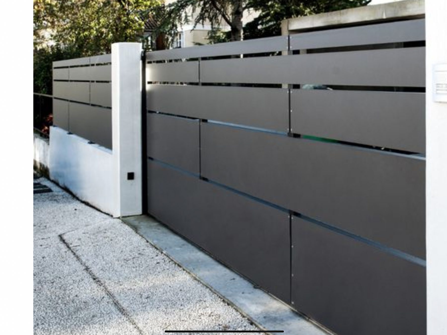 Modern slatted aluminum fence and gate